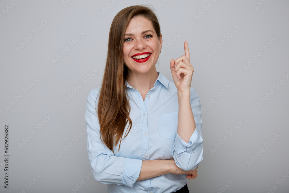 Smiling business woman pointing finger up. Isolated happy female businessman portrait. Smiling business woman pointing finger up. Isolated happy female businessman portrait.