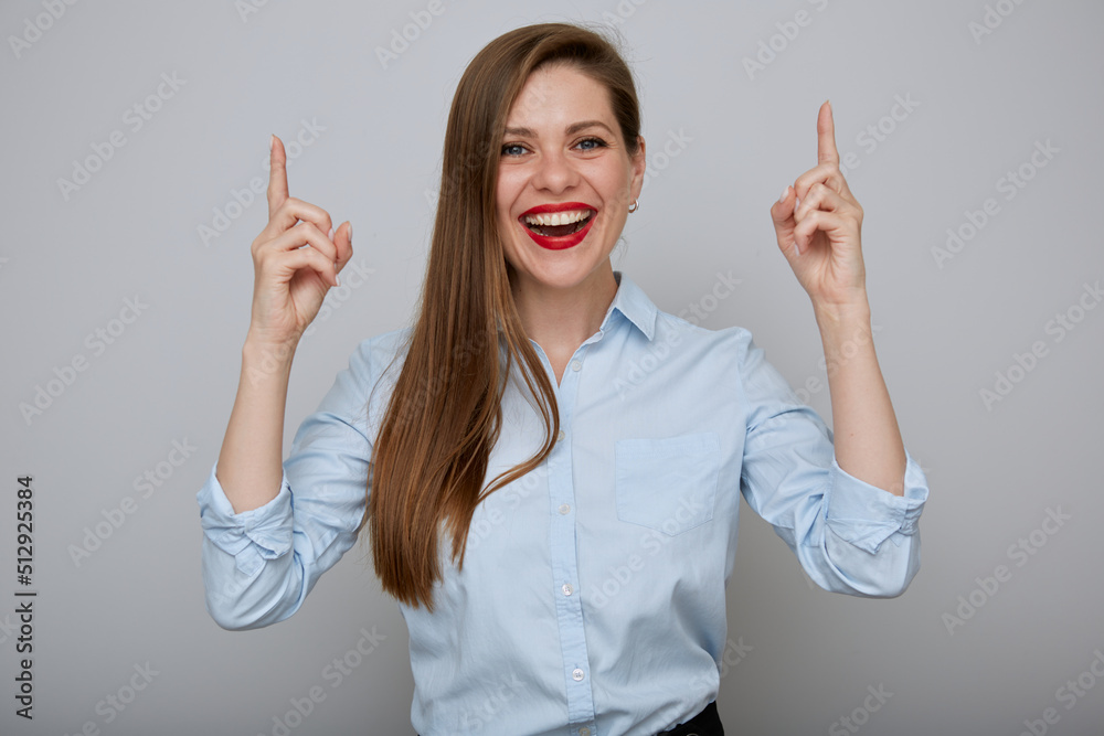 Smiling business woman pointing fingers up. Isolated happy female businessman portrait. Smiling business woman pointing fingers up. Isolated happy female businessman portrait.