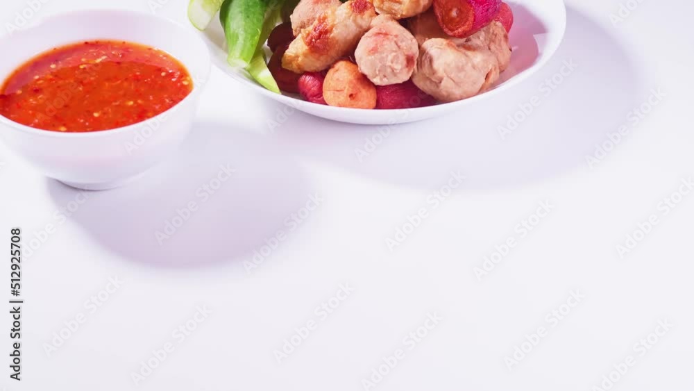 Fried meatballs and dipping sauce on a white background. Asian food daily style. Fried meatballs and dipping sauce on a white background. Asian food daily style.