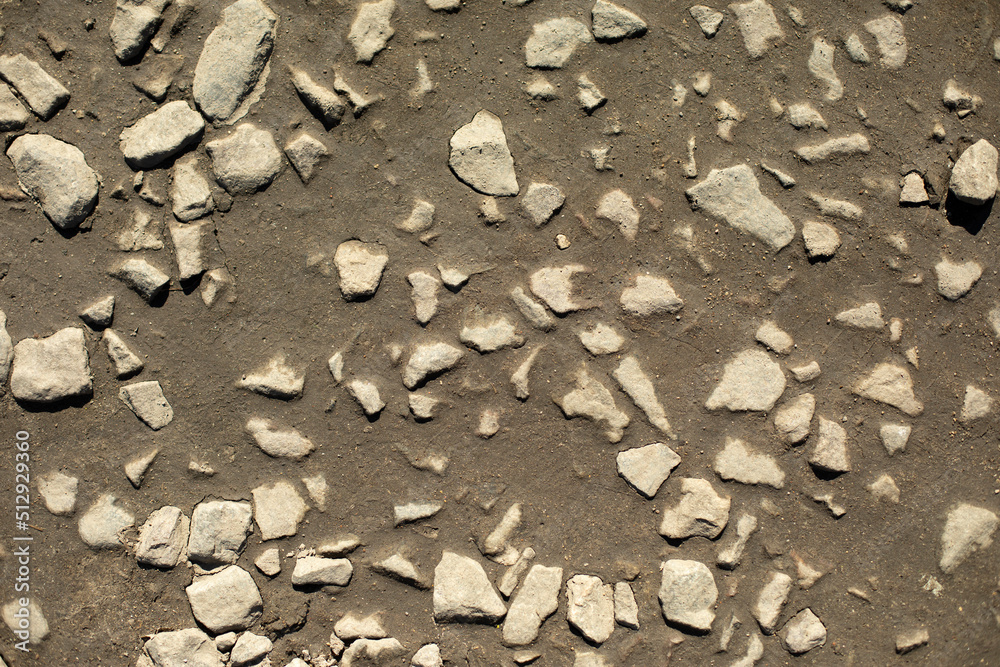 Fototapeta premium Rocks on road. Fine stone texture.