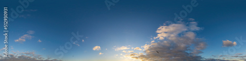 Panorama of a dark blue sunset sky with golden Cumulus clouds. Seamless hdr 360 panorama in spherical equiangular format. Full zenith for 3D visualization, sky replacement for aerial drone panoramas. © svetograph