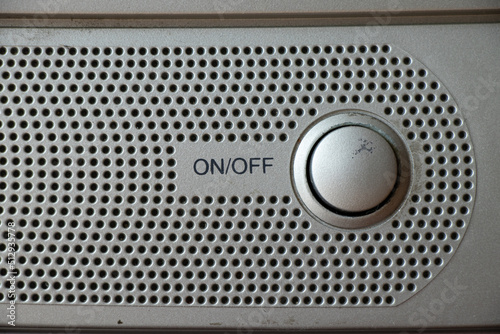 Buttons on an old gray TV close-up turn on and off, watch TV, buttons