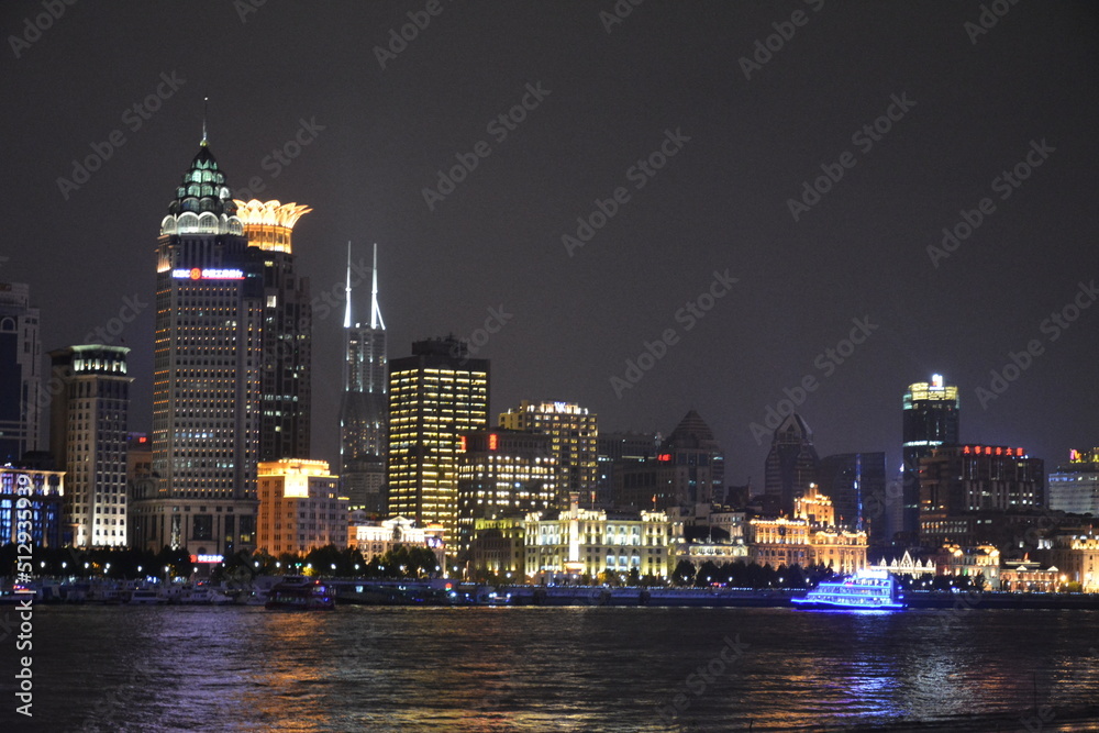View of night time Shanghai looking from the Pudong side of the Huangpu towards the Bund View of night time Shanghai looking from the Pudong side of the Huangpu towards the Bund