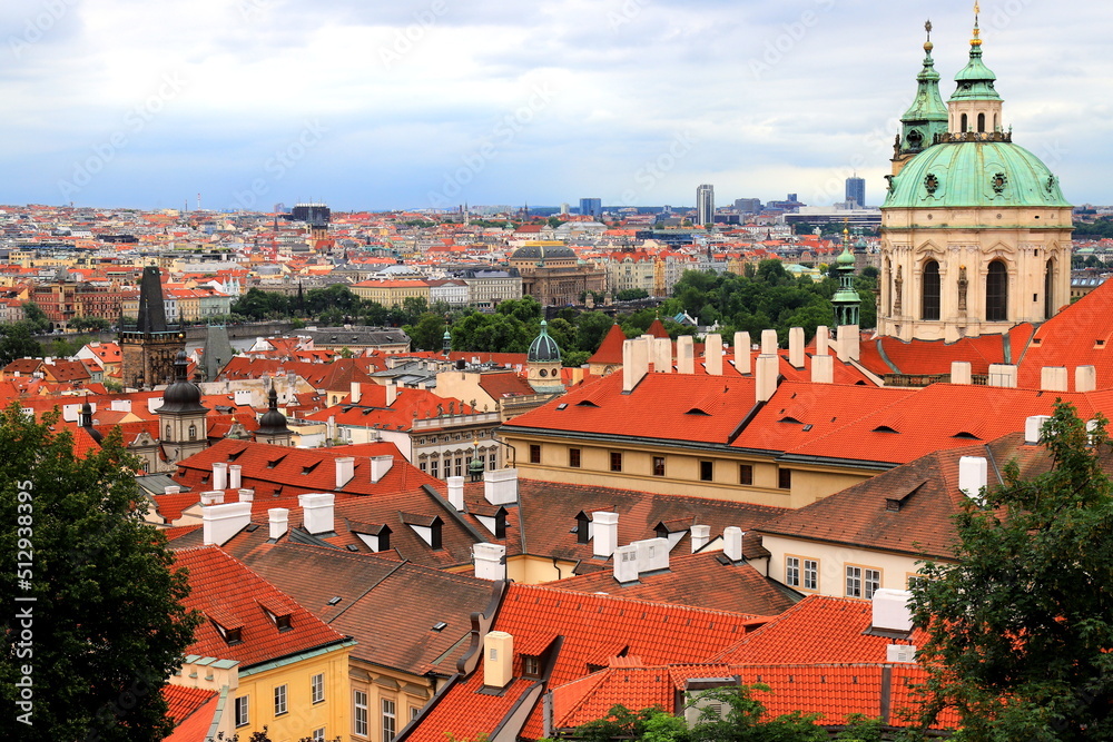 Fototapeta premium Prague, Czech Republic. Mala Strana, Lesser Town of Prague. Top view of downtown, panorama, old buildings with red tiled roofs, church, tower, castle