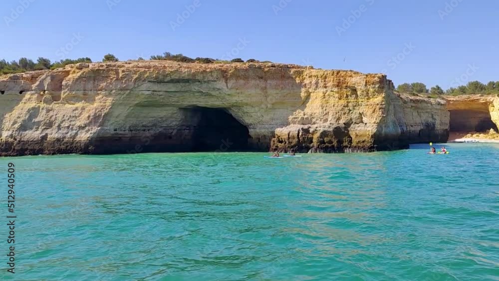 Kayaking in front of the caves in Portugal Kayaking in front of the caves in Portugal