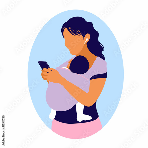 Woman uses a smartphone while holding a baby in a kangaroo bag. Mom wearing child in a sling. Mother's free hands. Newborn laid back nursing care. 