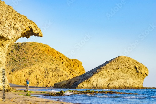 People walk on Monsul beach, Park Cabo de Gata, Spain photo
