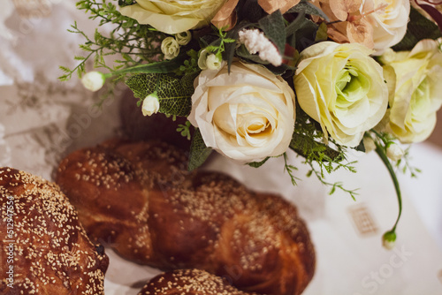 Flowers and Challah braided bread for Shabbat