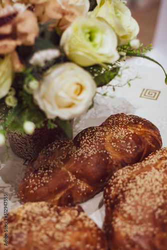 Flowers and Challah braided bread for Shabbat