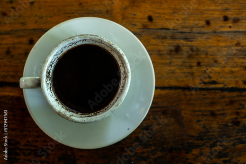 Black coffee on wooden table © Riecker photogallery