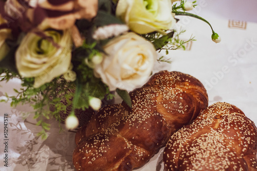 Flowers and Challah braided bread for Shabbat