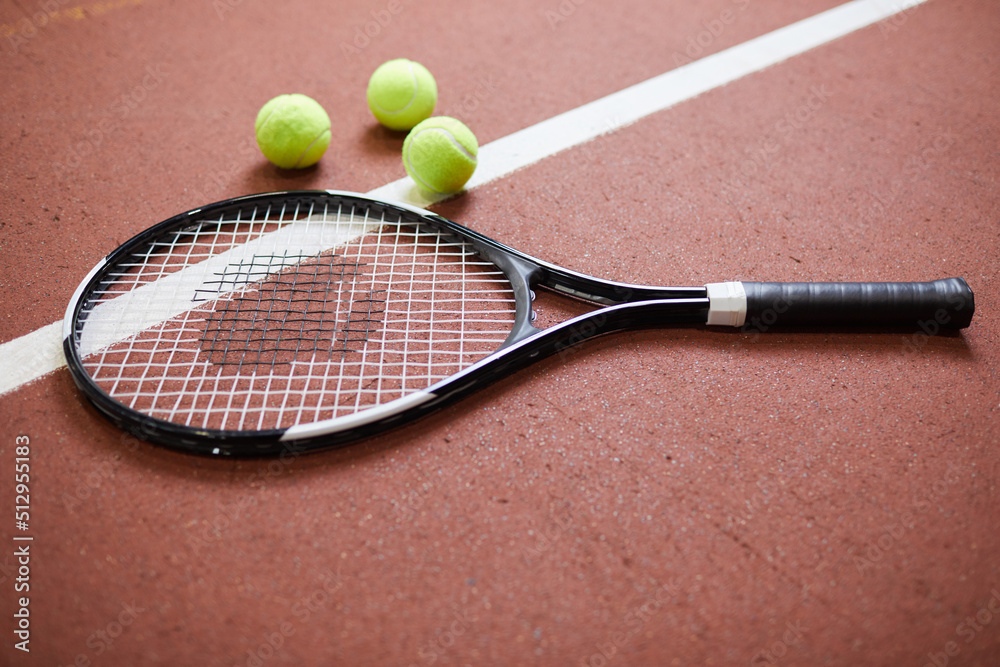 Close-up of recreational game equipment for tennis placed on court floor, tennis club concept