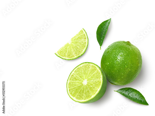 Flat lay of fresh lime with slices isolated on white background.
