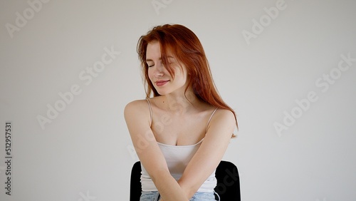 Attractive young woman touchingly looking sideways.