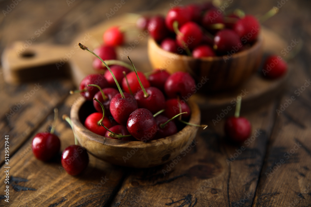 Fresh ripe cherries in a wooden bowl Fresh ripe cherries in a wooden bowl
