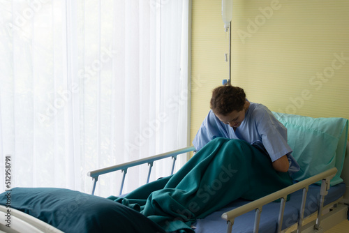 nurse in hospital, Female patients use abdominal hand to show abdominal pain.