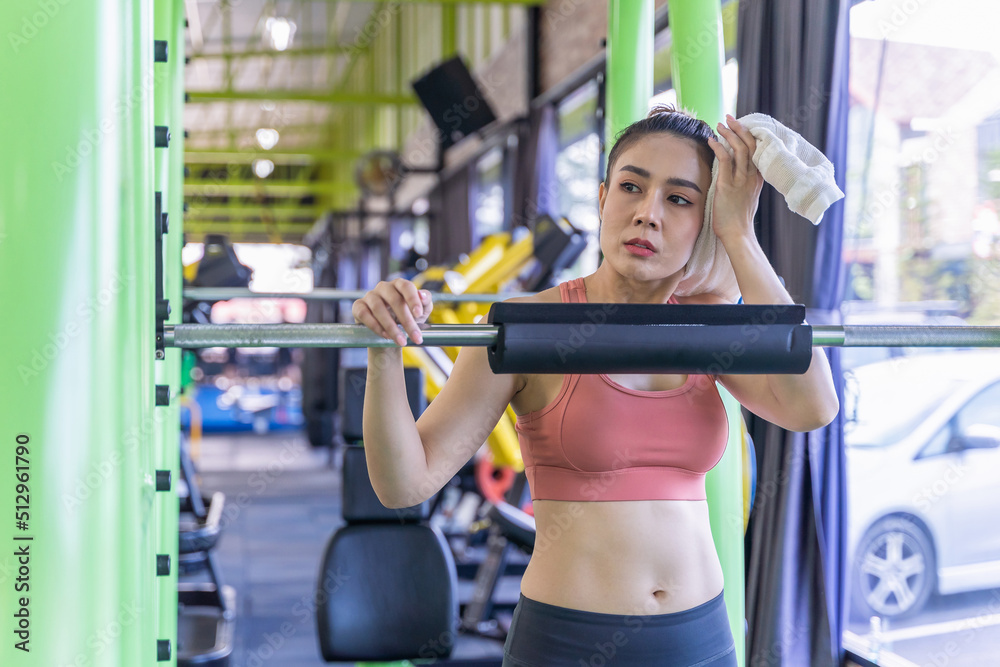 Fitness woman exercise workout in gym fitness breaking relax.