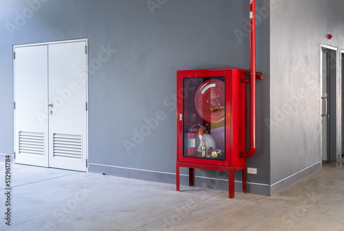 Fire extinguisher cabinet in the hall of office building for preparing to prevent fire, fire extinguisher equipment for protection photo