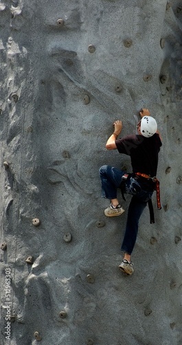 Young people climbing on climbing wall
