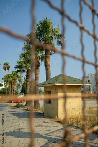 Metal fence view car palm building