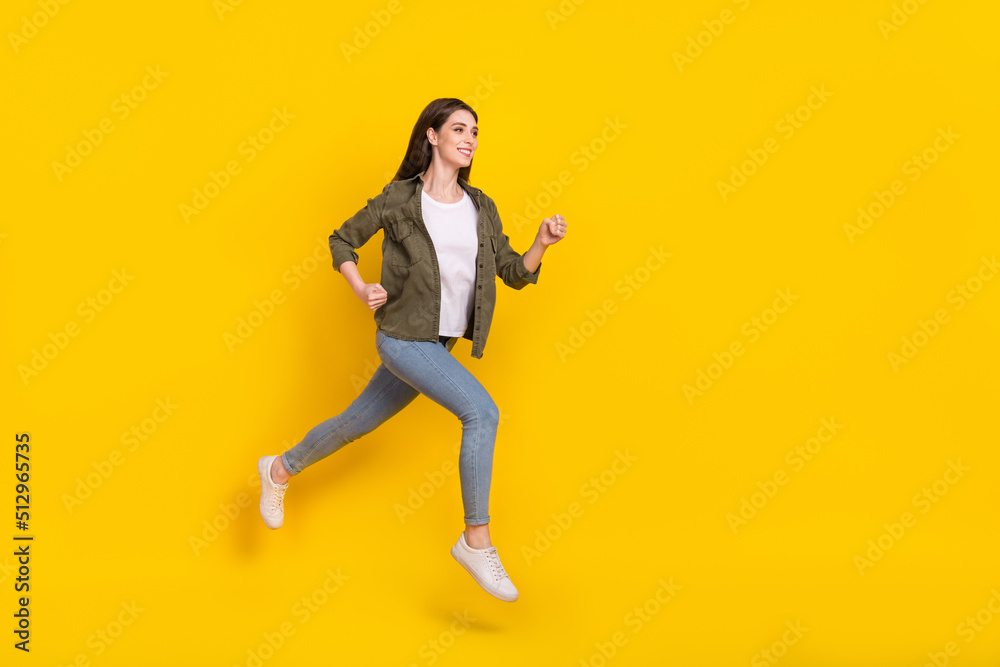 Full length profile side photo of dreamy energetic female travel around world isolated on yellow color background