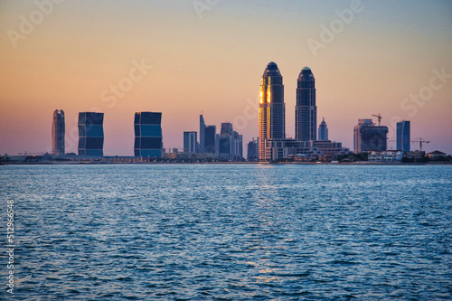 Doha city skyline from the water at sunset © g.photobox