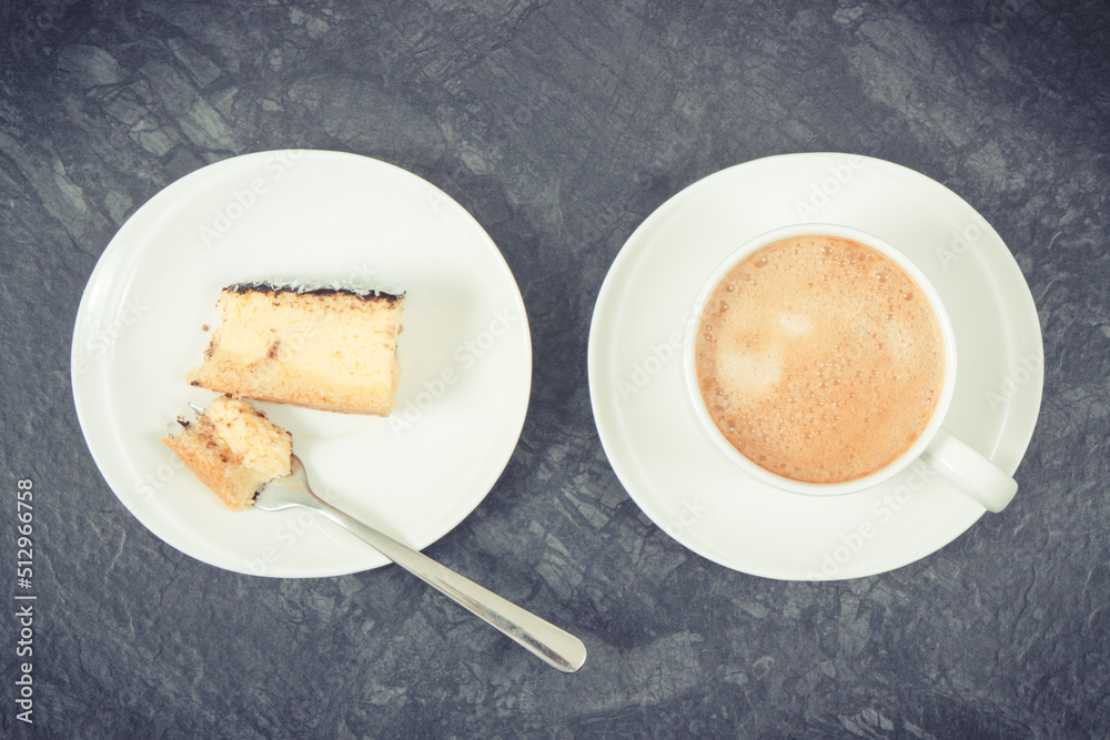 Fresh baked cheesecake and cup of coffee with milk. Delicious dessert Fresh baked cheesecake and cup of coffee with milk. Delicious dessert
