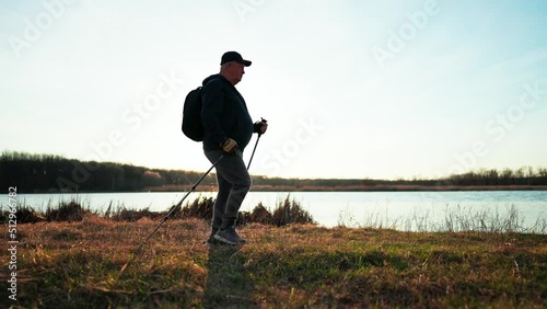 Wallpaper Mural Nordic walking. Silhouette of an elderly man with Nordic walking sticks at sunset. Torontodigital.ca