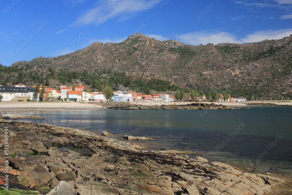 view of the harbor of a village on the coast