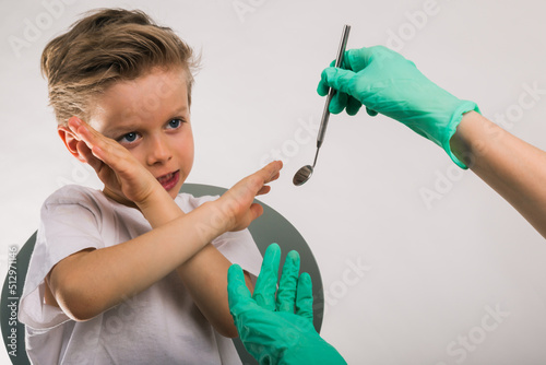 Dentist doctors hands. Scared kid patient in dental office. No fear of dentist concept