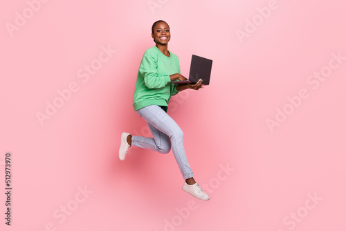Photographie Full length portrait of attractive energetic lady jumping write email isolated o
