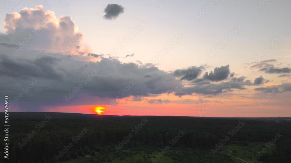 Beautiful sunset with golden light on a dark sky. Time lapse, evening sky at sunset. Weather, cloudy nature background, time lapse. Video, footage for transition or intro. UHD 4K. Beautiful sunset with golden light on a dark sky. Time lapse, evening sky at sunset. Weather, cloudy nature background, time lapse. Video, footage for transition or intro. UHD 4K.