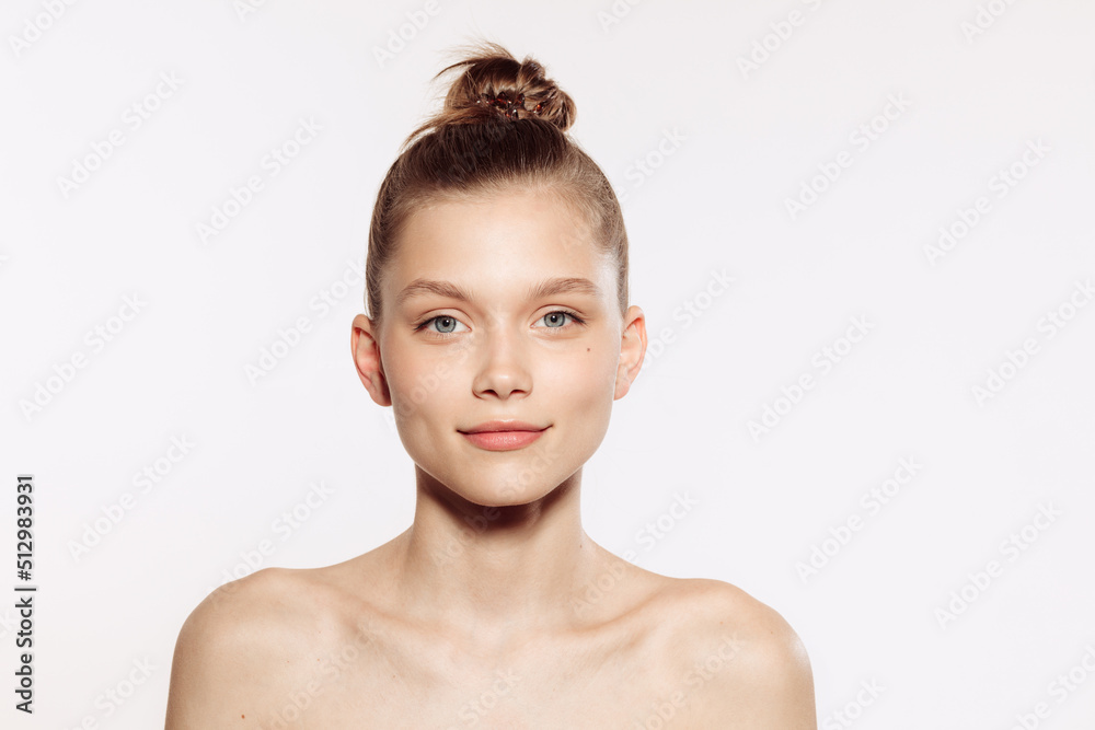 Portrait of young female fashion model without makeup isolated on white studio background. Spa, surgery, face lifting and skin care concept Portrait of young female fashion model without makeup isolated on white studio background. Spa, surgery, face lifting and skin care concept