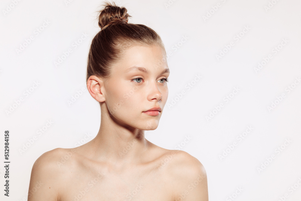 Portrait of young female fashion model without makeup isolated on white studio background. Spa, surgery, face lifting and skin care concept Portrait of young female fashion model without makeup isolated on white studio background. Spa, surgery, face lifting and skin care concept