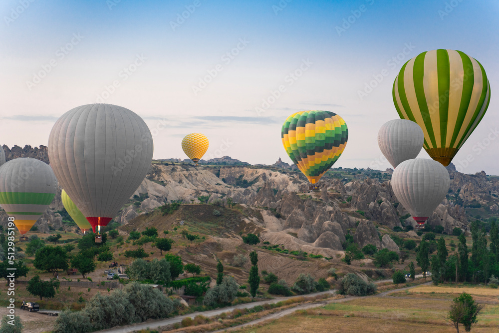 Naklejka premium Cappadocia balloons in turkey. Balloons at dawn in the valley of love.