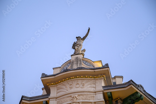 A statue of the Roman god Mercury on the top of Ljubljana's luxury department store Galerija Emporium
