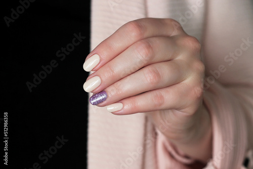 nude nails with purple glitter