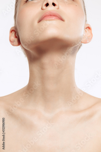 Close up female neck, collarbones isolated on white studio background. Natural beauty, fitness, diet, spa, plastic surgery and aesthetic cosmetology