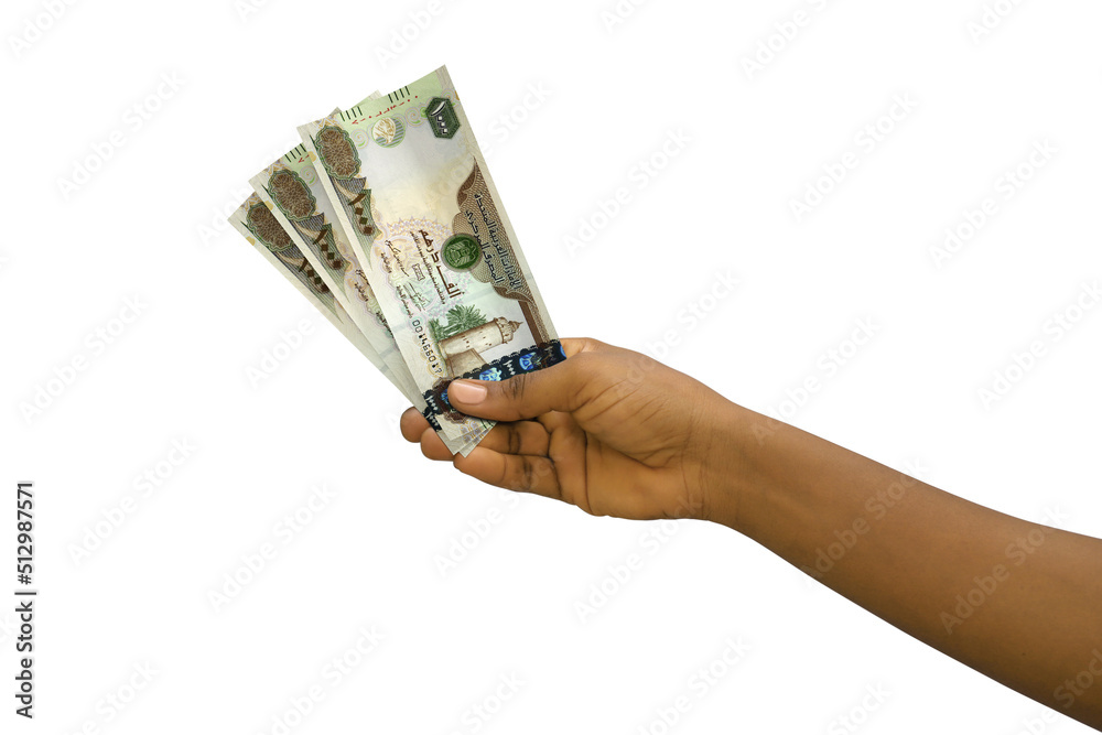 Fair hand holding 3D rendered 1000 United Arab Emirates dirham notes isolated on white background Fair hand holding 3D rendered 1000 United Arab Emirates dirham notes isolated on white background