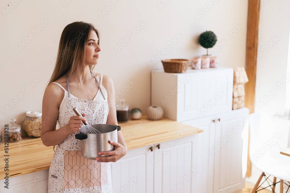 Young Housewife Preparing Eat in Warm Processing Young Housewife Preparing Eat in Warm Processing