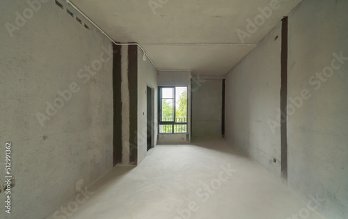 Empty under construction room in home or house with space on site. Interior. Old unfurnished room rental property  living space units. lifestyle. Renovation.