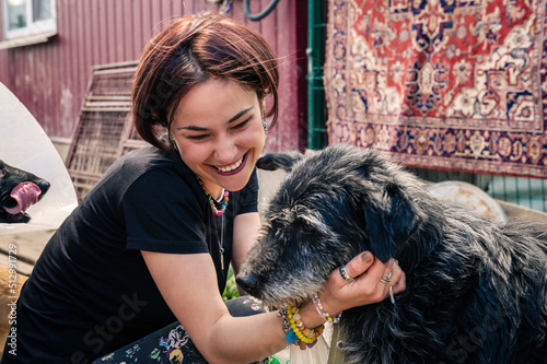 Dog at the shelter. Animal shelter volunteer takes care of dogs. photo