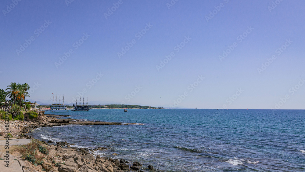 Small shallow sea creek with stones under the sun Small shallow sea creek with stones under the sun