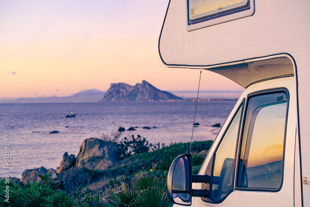 Fototapeta premium Caravan on spanish coast, Gibraltar rock on horizon