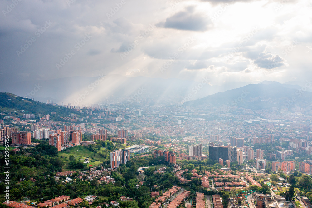 Fototapeta premium Rays of sun shining on the Colombian City of Medellin