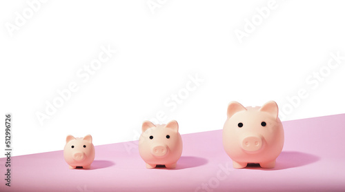 Piggy bank isolated on pink background. Saving money concept.