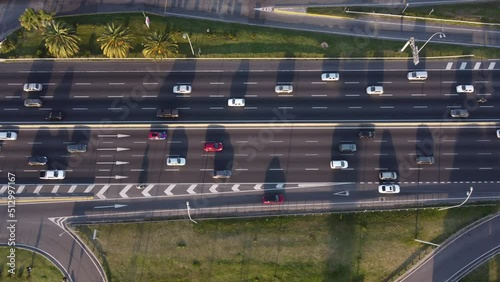 down tilt drone shot of the busy general paz highway at sunset in buenos aires in argentina