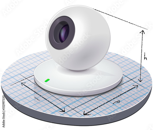 Spherical white webcam placed on a graph paper on which the dimensions of the device are drawn (cut out)