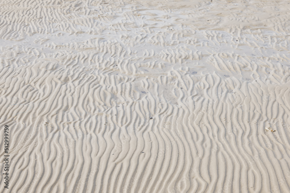 Beautiful shot of lines and patterns on the sand on a beach