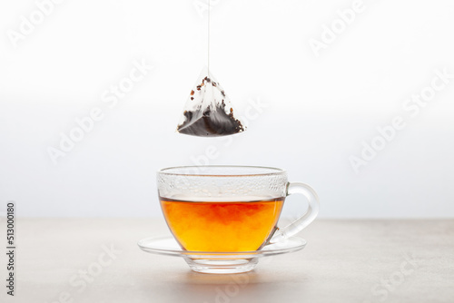 Cup of tea with a bag. Tea drink gradient